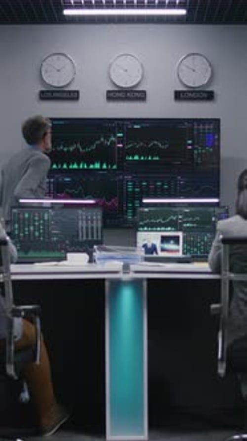Team of Traders Work on Multimonitor Computers