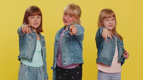 Three Cute Girls Friends Smiling Excitedly and Pointing to Camera Choosing Lucky Winner Indicating