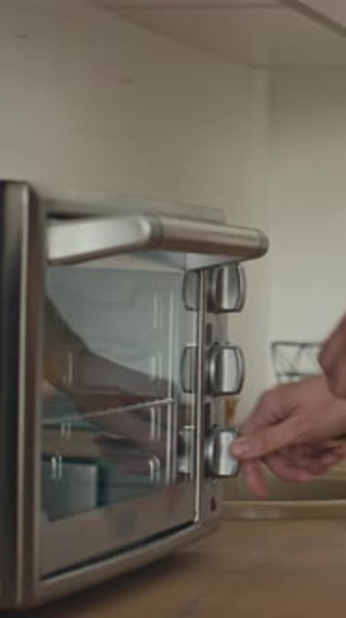 Placing Frozen Mini Pizzas in Toaster Oven