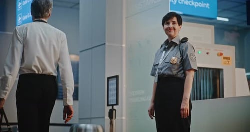 Airport Terminal Airline Pilot and Two Flight Attendants Walking After Commercial Flight