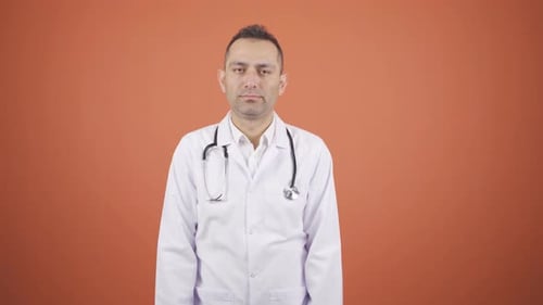Man in Doctor's Coat with Stethoscope Gestures