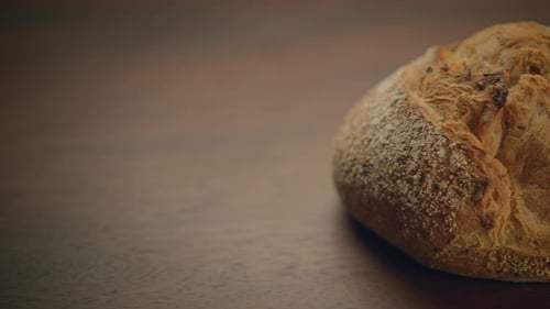 Rustic Bread Loaf on a Wooden Table