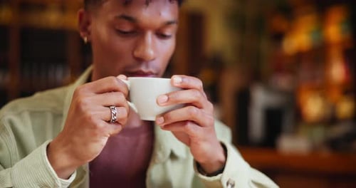 Drinking coffee, aroma and man in cafe for relax, peace or calm in restaurant for morning breakfast