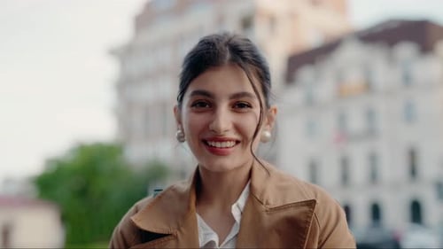 Young Woman Smiling in an Urban Setting