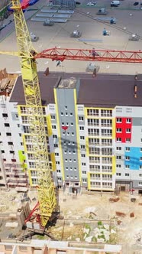 Construction of a multi-storey apartment building. Building of a multi-quarter houses in the city.