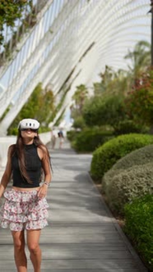 Woman Enjoys VR Technology in a Park Setting