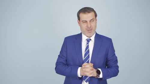 Man Checks Watch in Blue Business Suit