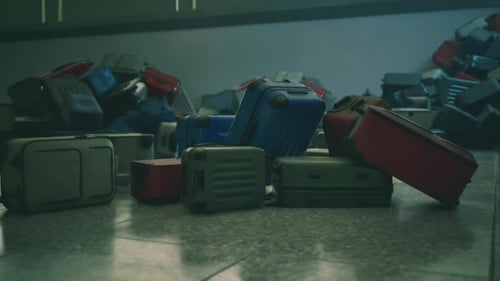 Abandoned Airport Luggage Scattered Across a Deserted Terminal Floor