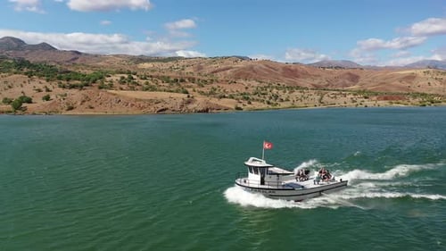 Aerial View Of Boat In The Dam Lake And Farmland On The Shore