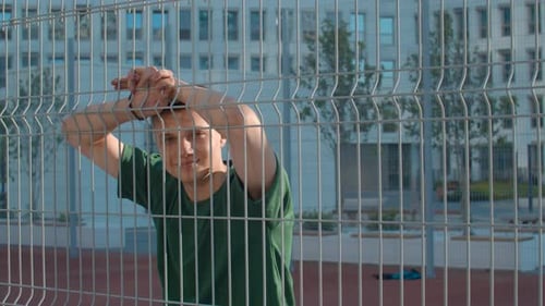 Young sportsman posing at basketball court