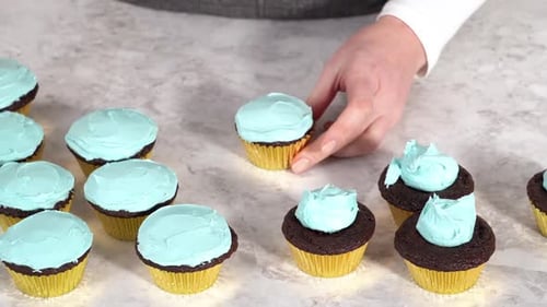 Decorating Chocolate Cupcakes with Buttercream Frosting and Rainbow Candy