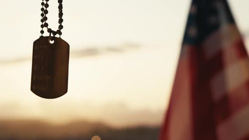 Dog Tag and American Flag at Sunset