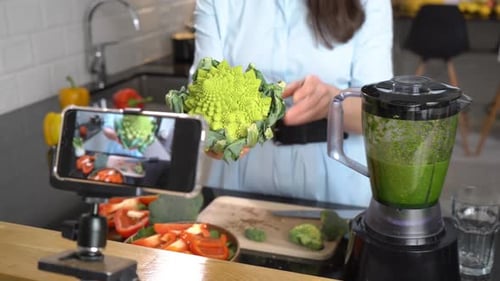 Woman Prepares Vegetables in Modern Kitchen