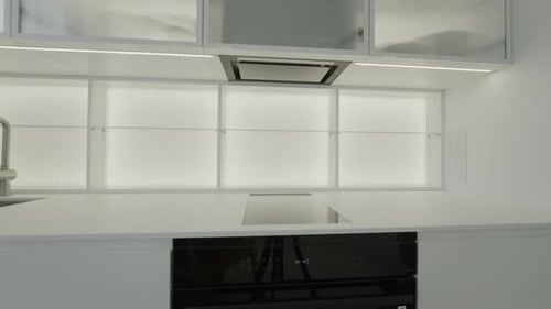Kitchen interior after home renovation with domestic appliance installation.