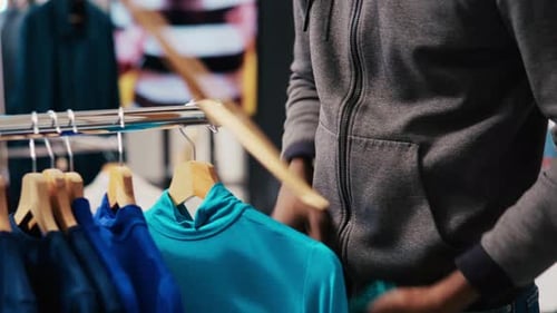 Thief Shoplifting Trendy Clothes