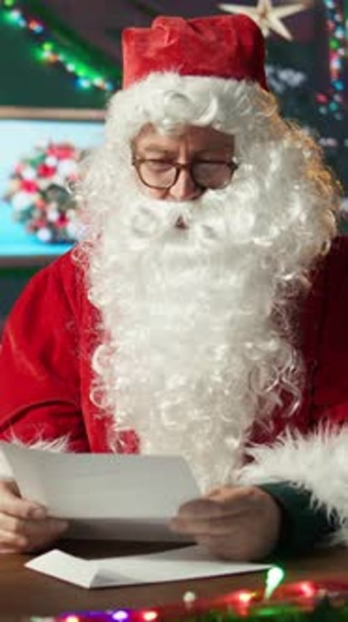 Santa Claus Reads Letter in Christmas Setting