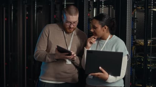 IT Specialists Working Together in Server Room