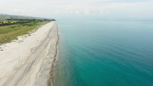 Empty Sandy Coast Aerial View Near the Meadow and the Ocean