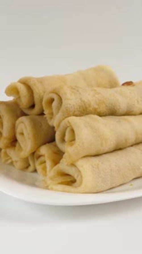 Stack of Delicious Crepes on White Plate