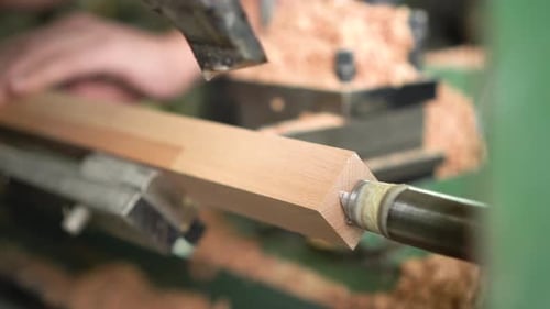 Automated Lathe Cutting Wood into a Cylindrical Dowel