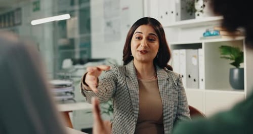 Woman Shakes Hand at Business Meeting in Office