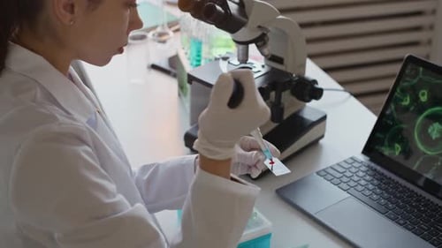 Scientist Analyzing Blood Sample in a Lab