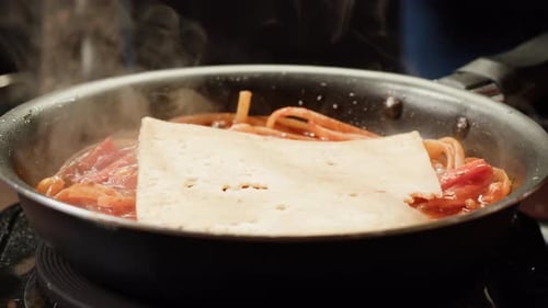 Pasta Cooking in Pan with Red Sauce
