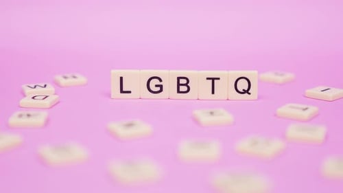 LGBTQ Tiles on Pink Background