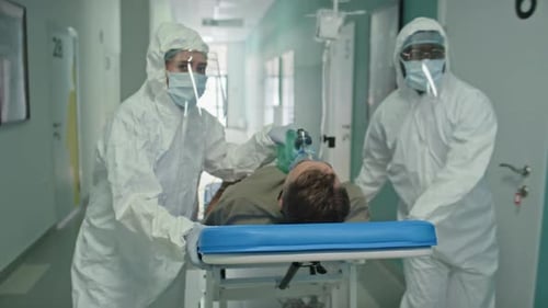 Emergency Workers Bringing Patient To Hospital