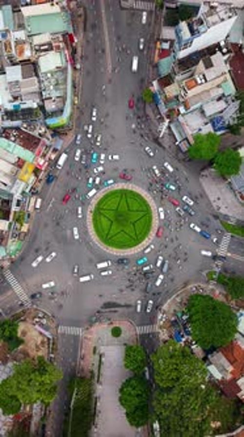Aerial Topdown Day Timelapse of Busy Roundabout in Ho Chi Minh City Vietnam