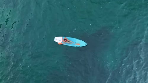 Aerial View Paddleboard Adventure in a Scenic Mediterranean Lagoon Beautiful Waters and Views