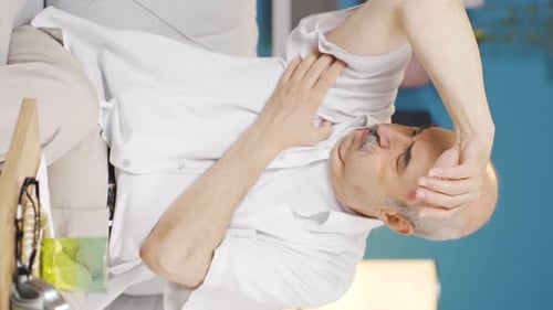 Vertical video of Old man with itchy armpits. Fungus Problem.