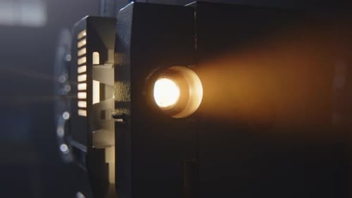 Antique Film Projector Casting Golden Light