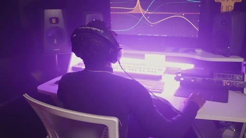 Sound Engineer Working with Music Track Using Computer Software