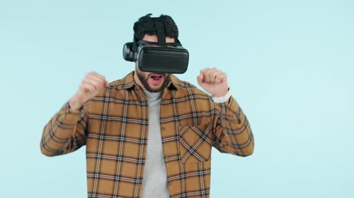 Virtual reality, metaverse and dance with a man using technology in studio on a blue background