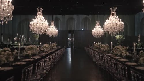 A gimbal forward movement wide shot of a wedding hall, luxury decoration, flower design, fancy inter