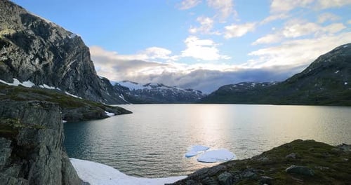 Sunset against the backdrop of the Norwegian mountains. Beautiful Nature Norway natural landscape.