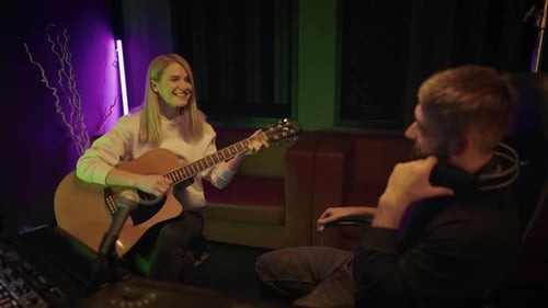 Woman Singer and Producer in Recording Studio Lady Guitarist Singing Song Audition and Meeting of