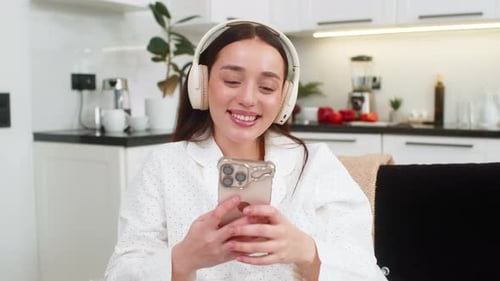 Woman Listening Music with Headphones, Using Smartphone