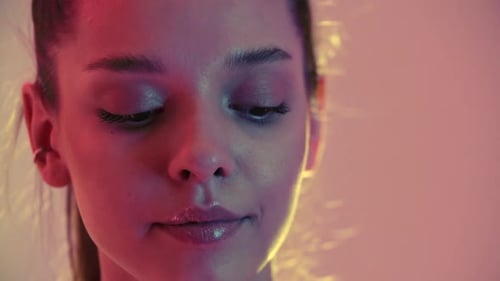 Close Up of Woman's Face in Studio Lighting