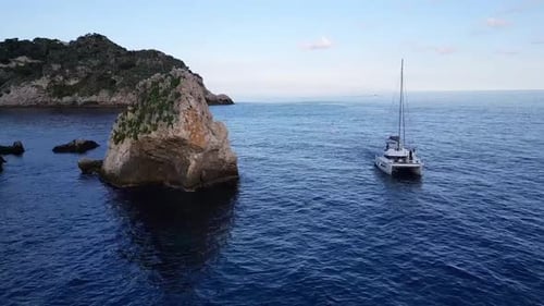 Boat Sailing The Sea In Taormina, Sicily, Italy - Drone Shot
