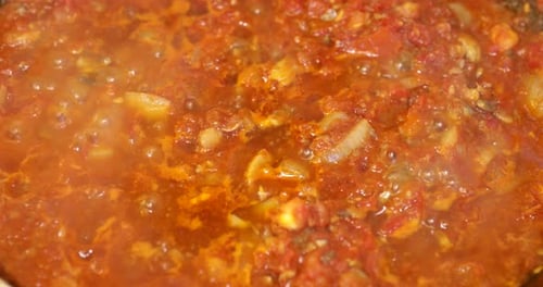 Red Cooking Sauce Simmering in a Pan