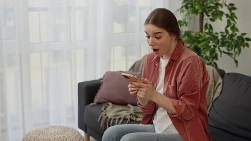 Woman Reacts to Good News on Phone
