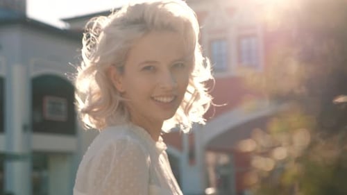 Blonde Woman Smiling in the Golden Hour Light
