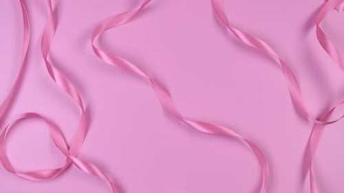 Pink Festive Delicate Pastel Background with Satin Ribbons the Concept of the Birthday of a Newborn