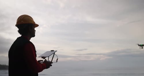Man Engineer Pilot Flying with Drone - Video Surveillance and Geology Survey