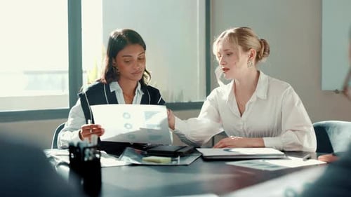 Business people, talking and women in office, documents or charts for budget report