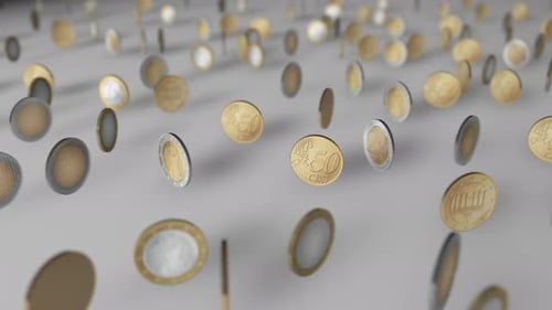 Dancing coins.
White background.
Depth of field.