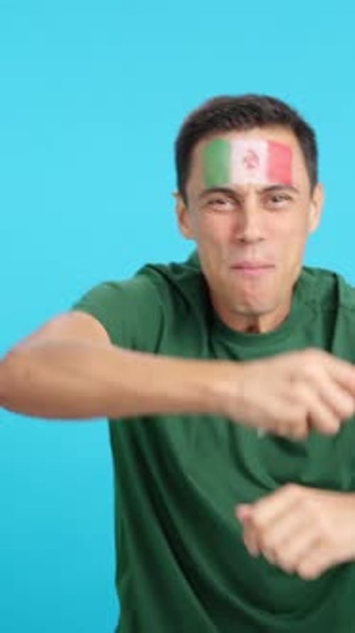 Excited Man with Flag Celebrates Success on Blue
