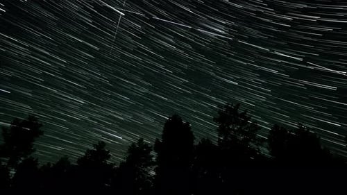 Cometshaped Star Trails in the Night Sky